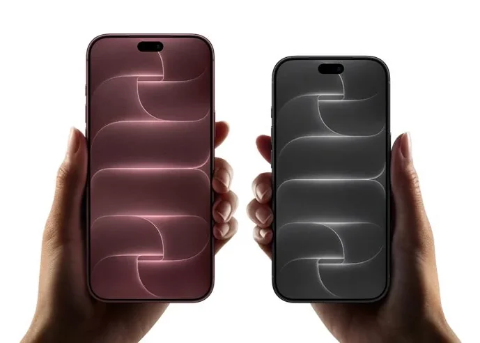 Two phones held side by side